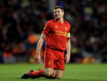 Down and out:  Gerrard's late goal wasn't enough for Liverpool